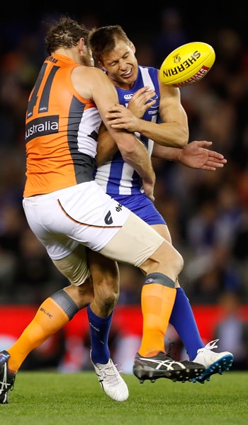 MUMFORD-PROFILE-BEST.png Shane Mumford crunches North Melbourne's Andrew Swallow with one of his trademark tackles. - GWS Giants,Sydney Swans,Geelong Cats,Shane Mumford
